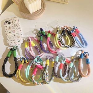 สายคล้องข้อมือป้องกันการสูญหายแบบใหม่ พร้อมแผ่นแปะติด สายรัดข้อมือไนลอนสีสันสดใส สายคล้องโทรศัพท์มือถือ - Product Image 1