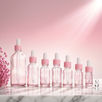 Bouteille d'huile essentielle en verre rose de fantaisie de 20ml en forme de cylindre avec compte-gouttes pour la beauté soins de la peau sérum et crème Commande minimum 500 pièces