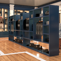 Magasin de vêtements de luxe vitrines meubles design personnalisé vêtements pour hommes armoires murales peinture bleue présentoirs muraux