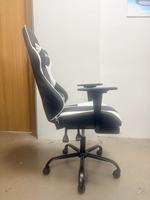 Chaise de bureau gaming ergonomique en cuir avec repose-pieds massant, accoudoirs fixes, pivotante, design mid-century, inclinable en 3 positions