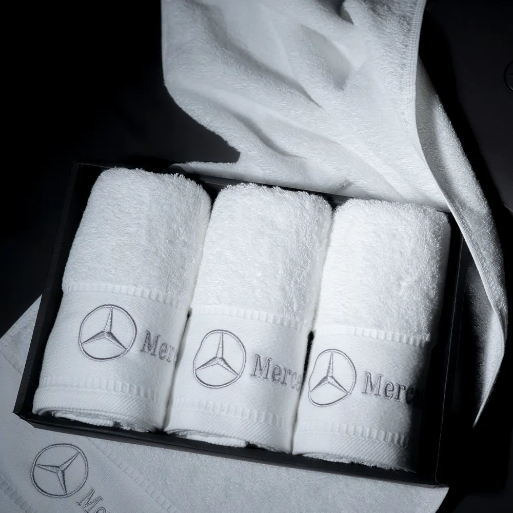 Set di asciugamani bianchi di lusso all'ingrosso dell'hotel 100% cotone terry ricamo per il viso asciugamano regalo Logo personalizzato