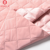 Remise 100% polyester 290gsm Release Emboss avec 300T Semi Dull Taffetas Cire imperméable ton à ton tissu pour doudoune