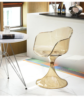 Chaise de salle à manger moderne en acrylique intégré transparent ambre, avec accoudoirs incurvés et dossier ergonomique, design coquille, pour la maison et le bureau