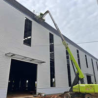 Atelier en acier à grande portée avec système de puits de lumière intégré et volets de ventilation automatiques