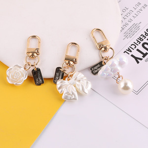Porte-clés coréen style nœud avec perles et pompon, mousqueton en alliage de zinc, accessoire portable, fournitures de fabrication de bijoux DIY - Product Image 1