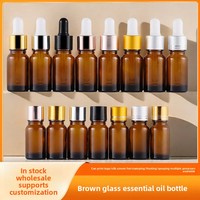 Bouteille en verre Transparent épaissie brune résistante à la lumière embout en plastique estampé à chaud compte-gouttes pour huile essentielle goutte pour les yeux