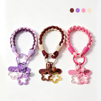 Dragonne de téléphone tressée avec breloques étoiles et clochettes, cordon en nylon bicolore, lanière courte tressée pour coque de téléphone ou porte-clés