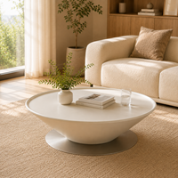 Table basse moderne et écologique de forme ronde avec plateau en bois finition crème et base en métal pour salon