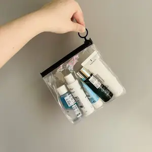 Bolsas de embalaje de exhibición cosmética impresas con logotipo personalizado bolsa de PVC transparente con cremallera para viajes