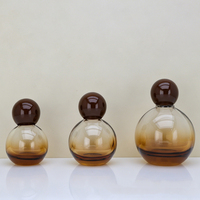 Vente en gros d'usine - Flacon de parfum sphérique en verre coloré de 30 ml, 50 ml, 100 ml, flacon pulvérisateur portable de type pression avec bouchon à bille
