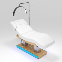 Table de massage électrique à 4 moteurs avec éclairage LED, colonne en acier inoxydable et base en bois, pour salon de tatouage et spa – Vente en gros usine