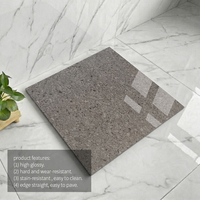 Carrelage de sol en porcelaine émaillée gris anthracite à motif terrazzo 600*600mm, super brillant, résistant au gel, pour salon et escalier