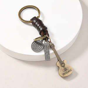 Llavero de Metal con Diseño Retro Punk Creativo, <span class=keywords><strong>Cuerda</strong></span> de Cuero Trenzada, Colgante de <span class=keywords><strong>Guitarra</strong></span>, Búho, Tortuga, Molino de Viento, Serpiente, Joyería, Regalo <span class=keywords><strong>para</strong></span> Hombre - Product Image 2