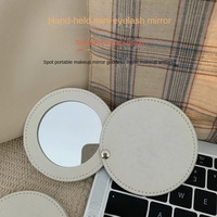 Miroir de maquillage compact rond en cuir PU rotatif avec logo personnalisé, idéal pour les cadeaux, vente en gros