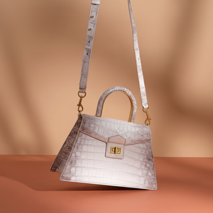 Elegant light <b>grey</b> crocodile-textured leather <b>handbag</b> with a subtle sheen, a top handle, at wholesale prices. - Product Image 1