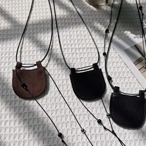 <b>Mini</b> halter neck <b>bag</b>, minimalist style, perfect for street fashion, stylish accessories, and a crescent-shaped necklace. - Product Image 1