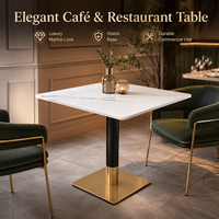Table à manger de luxe en marbre, plateau carré en pierre frittée de 70 cm avec base noire et dorée pour hôtel, restaurant et bar