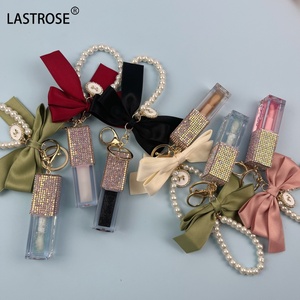Hochwertiges Bling Tube Makeup Frucht geschmack Lippen öl New Bow Key chain Lippen pflege Feuchtigkeit söl Großhandel - Product Image 2