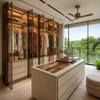 Dressing de luxe surélevé de style singapourien avec portes en verre bronze teinté et commode îlot multi-niveaux pour chambre principale