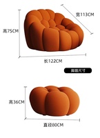 Fauteuil individuel de relaxation Roche Bobois Bubble Comfort, design moderne et luxueux, avec accoudoirs rouges, pour salon