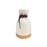 Diffuseur d'huiles essentielles en forme de pochette, humidificateur ultrasonique silencieux avec lumière chaude, design en corde de cuir, brume fine, décoration d'intérieur et cadeau