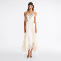 Gaun Maxi Wanita Custom dengan Label Pribadi, Warna Putih Gading, Renda Makrame, Kerah V, Tali Spaghetti, Potongan Asimetris, dan Detail Cut Out
