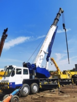 Grue sur camion TADANO GT-550E d'occasion, d'origine japonaise, facile à utiliser, capacité de levage de 55 tonnes, pompe moteur PLC, faible nombre d'heures de fonctionnement