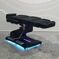 Meubles de salon de beauté modernes entièrement noirs, table de massage à 4 moteurs rotatifs, fauteuil de soin du visage électrique inclinable de luxe, lit de spa