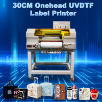 Nouvelle imprimante d'étiquettes UV DTF 30 cm en gros de l'usine chinoise, tête DTF, enrouleur UV, film AB, couleurs or/argent, entièrement automatique 1