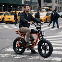 Vélo électrique élégant à gros pneus avec freins à disque de qualité supérieure, vélo de banlieue électrique orange pour les trajets urbains quotidiens