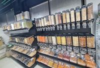 Présentoir de supermarché à poubelle à gravité en plastique dispensadores de granos distributeur de grains pour aliments en vrac