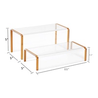 Support de présentation moderne en acrylique transparent pour sacs à main et chaussures avec cadre doré élégant pour présentoir de vitrine