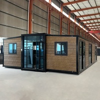 Conteneur pliable à double aile 40 pieds Cabine préfabriquée Maison prête à l'emploi Maison conteneur extensible avec chambre à coucher