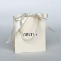 Sacs en papier de luxe blancs personnalisés avec logo pour boutiques de détail et cadeaux, fabriqués en Chine, vente en gros