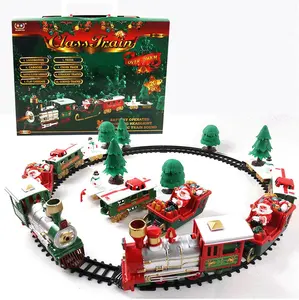 I giocattoli del treno di natale impostano con luci e suoni i regali del treno di natale ferroviario assemblano le auto che tracciano il giocattolo educativo per i bambini