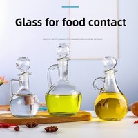Bouteilles en verre transparentes en stock, design moderne et minimaliste, poignée sculptée en forme de fleur pour cuisine ; bidon à huile, bouteille de vin