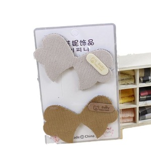 Pinces à cheveux style coréen en forme de nœud avec autocollants magiques pour fixer les franges, usage quotidien, couleur aléatoire, en résine plastique, fabriqué à Yiwu - Product Image 4