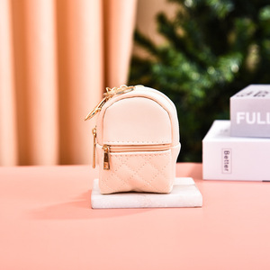 Sac de maquillage circulaire léger en cuir PU, vente en gros d'usine, avec poche à clés, sac à rouge à lèvres, mini sac à dos, porte-monnaie, pendentif pour femme - Product Image 2