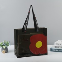 Bolsa de PVC Gris Oscuro Personalizada con Correa Negra y Diseño Floral Transparente para Regalos y Empaquetado Minorista