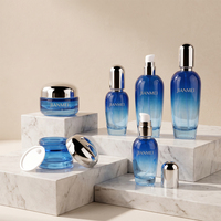 Ensemble de pots à crème pour le visage et flacons de lotion en verre bleu dégradé avec bouchon argenté pour l'emballage cosmétique