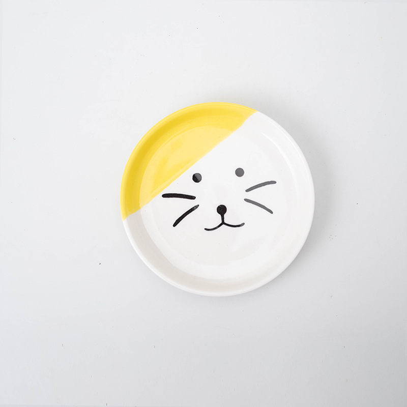 Plato individual con cara de gato amarillo