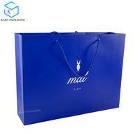 Sac à provisions en papier personnalisable pour vêtements et bottes, sacs d'emballage en papier imprimé de haute qualité avec poignées