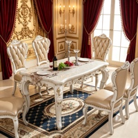 Ensemble de table à manger en marbre européen, chaises en bois massif sculptées à la main, revêtement en cuir capitonné, meubles de salle à manger de luxe pour villa