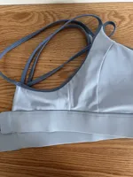 Soutien-gorge de sport pour femme, ajusté, à rembourrage fixe double face, style débardeur croisé, pour la gym, la course, le fitness et le yoga