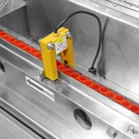 Machine automatique HONGREAT pour l'ajout de capuchons aux tubes de prélèvement sanguin