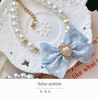 Collier de chien en nylon rose avec décoration de rivet pour petits chiens et chats.