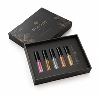 Boîte d'emballage rigide noire personnalisée en usine avec plateau multi-compartiments pour les marques de parfums et de cosmétiques