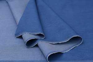 Tissu en denim de coton 12,1 oz toutes saisons, matériau extensible indigo slub pour la production de vêtements - Product Image 4