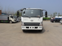 Camion compacteur de déchets à chargement arrière manuel FAW Jiefanghu VH 4x2 - 8-12 mètres cubes pour une collecte efficace des déchets municipaux