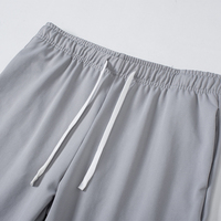 Pantalon de survêtement unisexe respirant grande taille pour homme et femme, idéal pour l'été, le fitness, le basketball, la formation, taille élastique, séchage rapide, effet délavé à l'acide